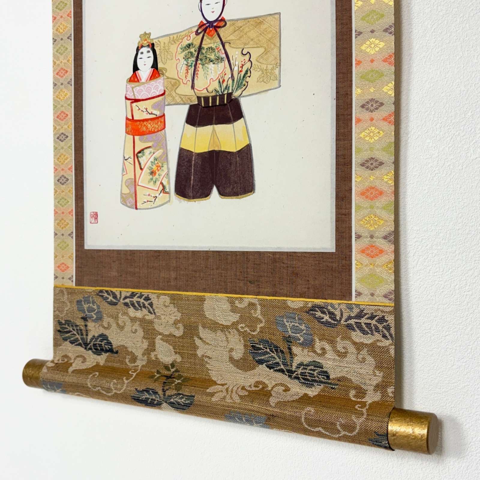 Scroll end detail of “Hina Doll – Gentle Smile” hanging scroll